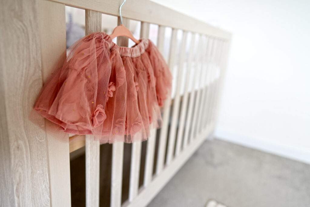 Dusty pink tutu hung on cotbed- MK Kids Inteirors-Children's Interior Stylist